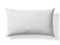 White rectangular pillow on a plain background, showcasing its smooth texture and lightly rounded edges.