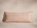 Rectangular Raw Silk Pillow in blush pink with textured, hand-woven fabric and merrow stitch edges, lying flat.