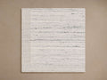 Aiden Performance Rug Swatch. Off-white rectangular swatch with textured horizontal grey stripes and a cream woven border.