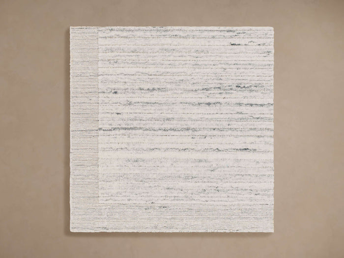 Aiden Performance Rug Swatch. Off-white rectangular swatch with textured horizontal grey stripes and a cream woven border.