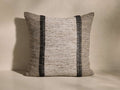 Front view of the Akara Embroidered Pillow, featuring textured ivory raw silk with two vertical onyx paneled embroidery stripes.