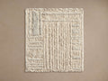 Alta Hand-Knotted Rug Swatch in beige with a textured, linear pattern. Rectangular, showcasing stitches and construction detail.