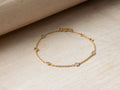 Alvita Bracelet featuring rose-cut diamonds and gold-plated sterling silver chain, with a shepherd's hook closure on a neutral background.