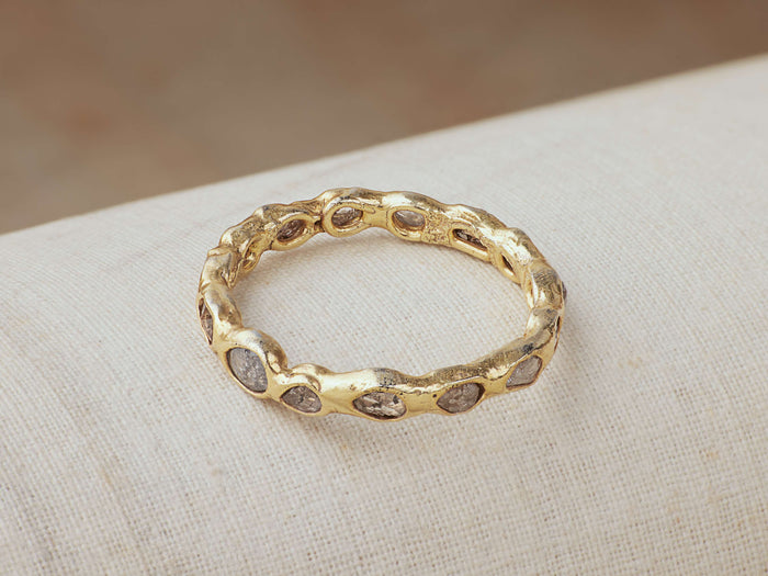 Alvita Multi Ring featuring a textured gold-plated sterling silver band with embedded rose-cut diamonds, displayed on a soft surface.