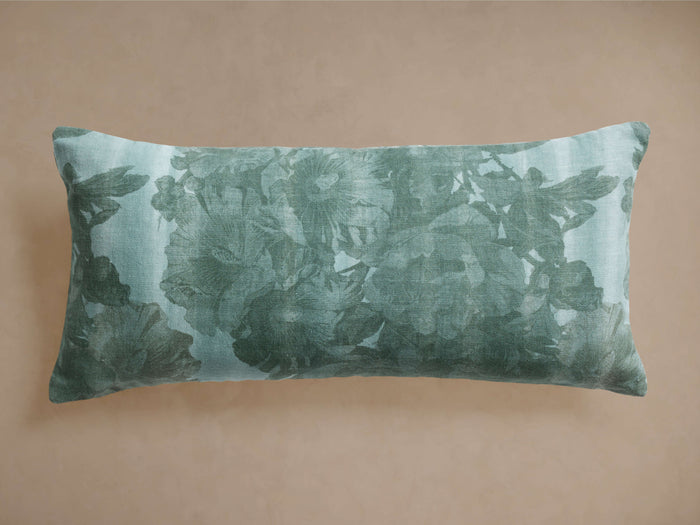 Rectangular Amanda Lumbar Pillow in sage green linen, featuring a subtle floral motif in varying shades of green.