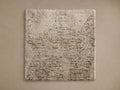 Anala Rug Swatch in light beige with textured surface and speckled pattern featuring grey and brown tones, on a neutral backdrop.