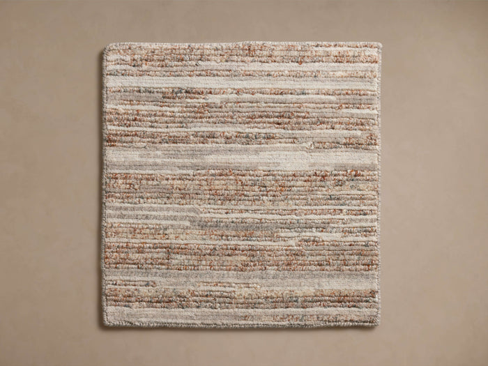 Top-down view of Anson Hand-Knotted Rug Swatch with horizontal textured stripes in cream, brown, and grey tones.
