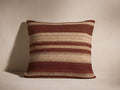 Aris Variegated Stripe Pillow, square, featuring alternating horizontal stripes of deep reddish-brown and textured beige.