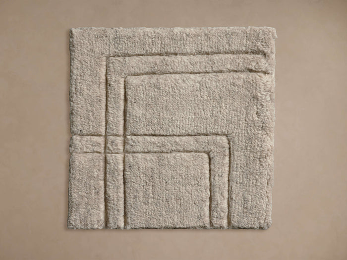 Asher Hand-Knotted Rug Swatch in beige, showing a textured, layered square pattern on a neutral background.