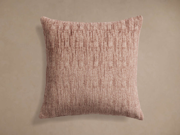 Aubree Chenille Pillow in Blush, a square pillow with textured, subtle vertical stripe design on a light brown background.