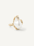 Gold ring with a large pearl on a white background
