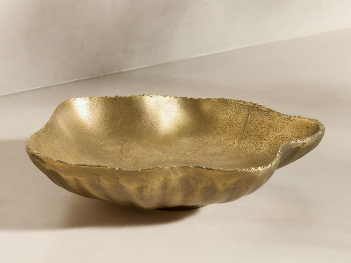 Front view of the gold, textured, organically shaped Aurelian Bowl with an irregular rim.
