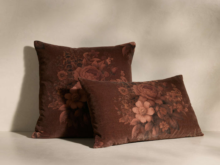 Two rust Avila Pillows in velvet, one square, one rectangular, featuring a digital floral print in varying rust tones.
