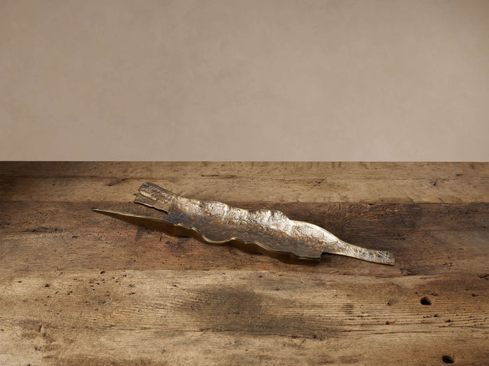 Elongated Bark Texture Tray, distressed dark bronze aluminum, textured like bark, on a rustic wooden surface.