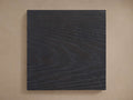 Bodhi Finish Board. Rectangular dark grey wood sample with prominent horizontal grain texture, displayed against a neutral background.