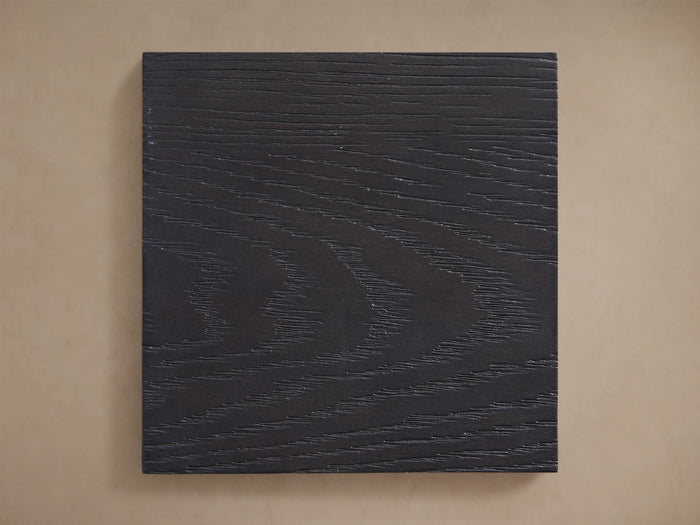 Bodhi Finish Board. Rectangular dark grey wood sample with prominent horizontal grain texture, displayed against a neutral background.