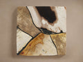 Square Boracay Finish Board showing abstract wood grain patterns in shades of black, white, brown, and golden-brown, separated by dark lines.