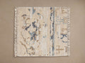 Brielle Hand-Knotted Rug Swatch: Cream colored with abstract light blue, dark blue, and brown patterns, fringe edges, flat.