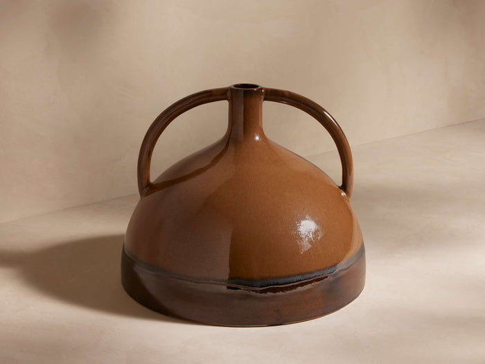 Bronwen Double Handle Jug Vase: Glazed ceramic, light brown to dark brown/black gradient, with two curved handles & narrow neck.