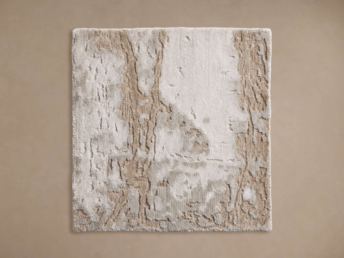 Burke Hand-Knotted Rug Swatch featuring a textured, abstract pattern in beige and ivory tones, shown on a neutral background.