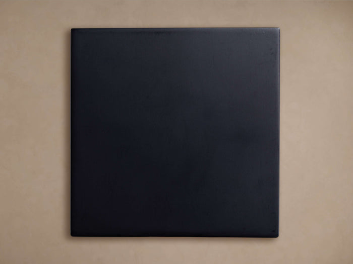 Dark blue-black Cadence Finish Board, square, with a smooth matte finish, centered against a light beige background.