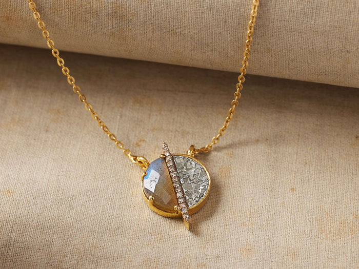 Cairn Necklace with round labradorite pendant featuring a diagonal stripe of pave diamonds set in gold vermeil on a fine chain.