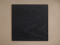 Calvin Finish Board: Black rectangular wood sample, rich horizontal grain texture, flat on a neutral background.