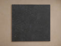 Rectangular Cascade Outdoor Finish Board, dark gray with rough, textured surface, against a warm brown background.