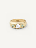 Gold ring with a pearl and green gemstones on a white background