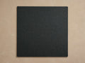 Coden Outdoor Finish Board, a dark gray square with a pebbled texture and slightly rounded corners, centered on a light beige background.
