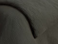 Close-up of a dark green Cotton Gauze Duvet, showcasing its soft, crinkled texture and gentle folds.