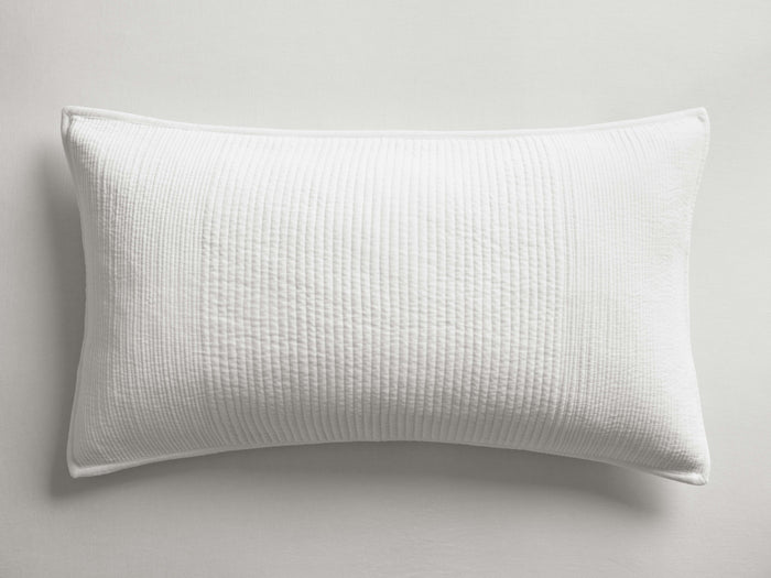 White Daria Velvet Sham, rectangular, with a subtle vertical quilted texture and corded piping on a light background.