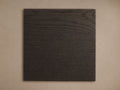 Dark rectangular Darien Finish Board with prominent horizontal wood grain texture against a light beige background.