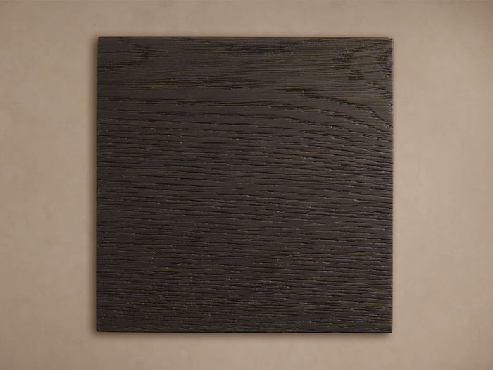 Dark rectangular Darien Finish Board with prominent horizontal wood grain texture against a light beige background.