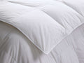 Close-up of a folded white Down Duvet Insert, showing its thick, fluffy texture and square baffle-block quilting.