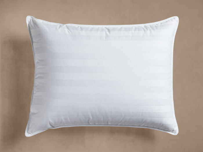 Front view of a white Down Fill Pillow Insert with subtle damask stripes and white piping around the edges.