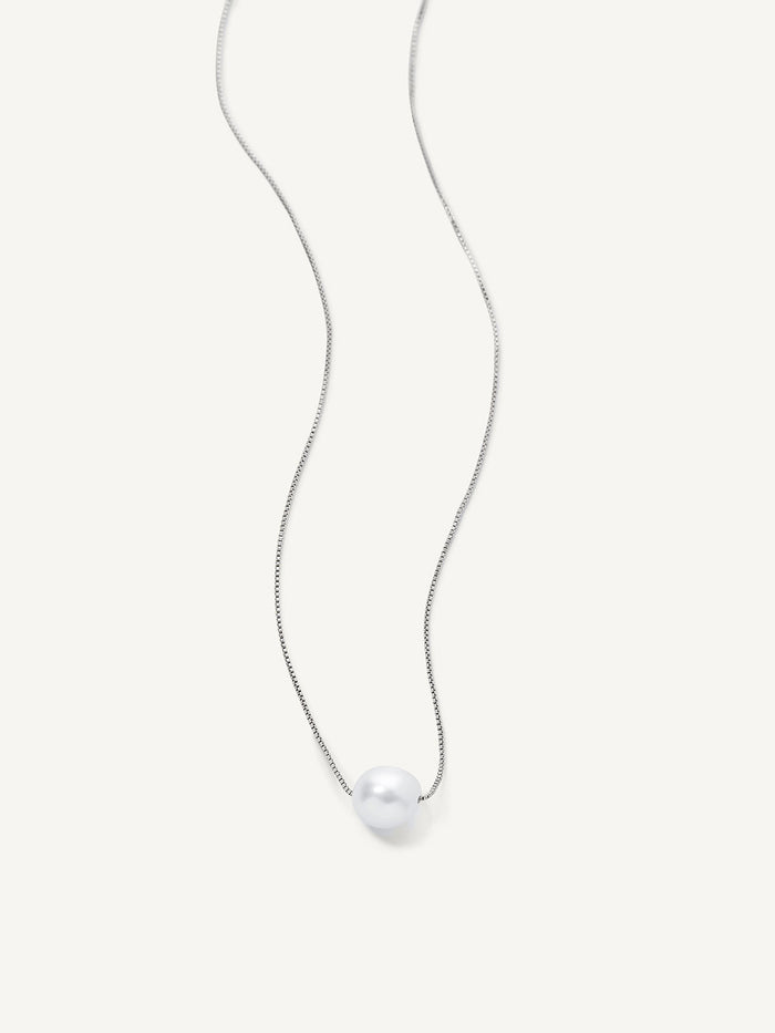 A single freshwater pearl pendant necklace on a silver-plated chain, presented against a white background.