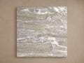Edgewater Outdoor Finish Board in Faux Marble, a square panel with swirling gray, white, and brown veining, on a beige wall.