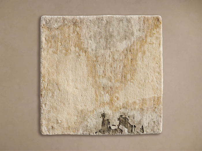 Square Ember Hand-Knotted Rug Swatch. Creamy off-white with mottled brown & darker irregular pattern at bottom.
