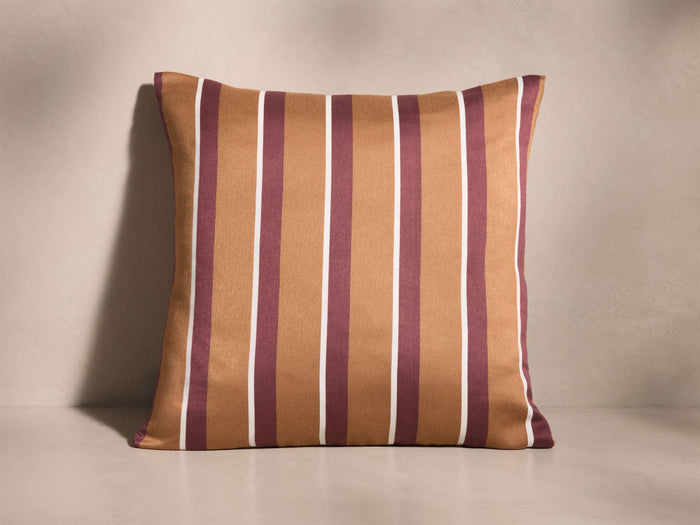 Front view of an Epworth Pillow with a jacquard stripe pattern in warm brown, burgundy, and thin white.