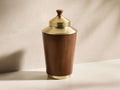 Front view of the Errol Cocktail Shaker, featuring a warm walnut mango wood body, brass-finished top, bottom, and lid, with a wooden finial.