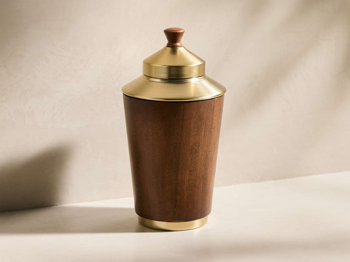 Front view of the Errol Cocktail Shaker, featuring a warm walnut mango wood body, brass-finished top, bottom, and lid, with a wooden finial.