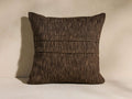 Square Esencia Pleated Pillow in textured dark brown with two horizontal pleats across the center, standing upright.