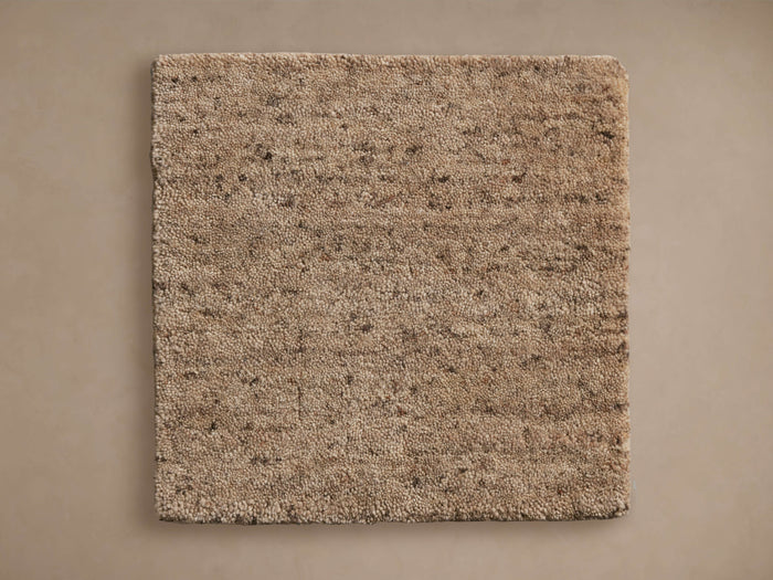 Square Farris Rug Swatch in beige with a textured, plush surface on a neutral background, showing color and construction details.