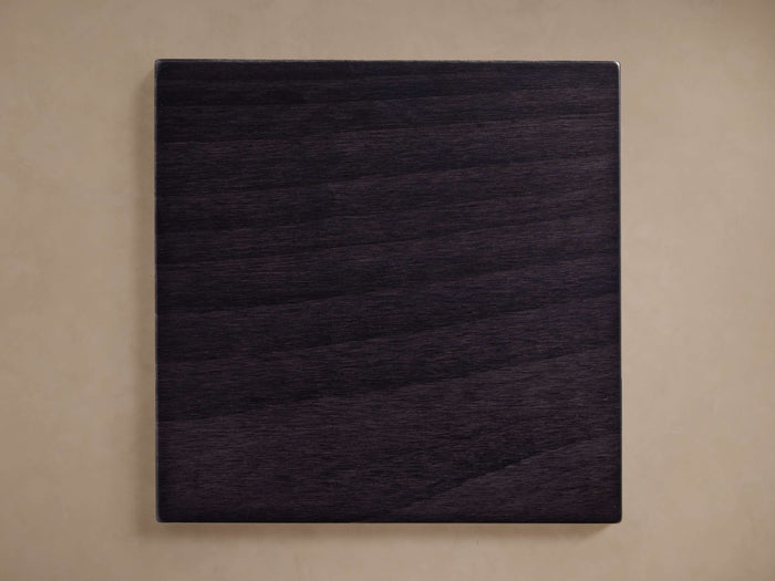 Jordan Finish Board: Dark espresso square wood sample with horizontal grain, centered on a light beige background.