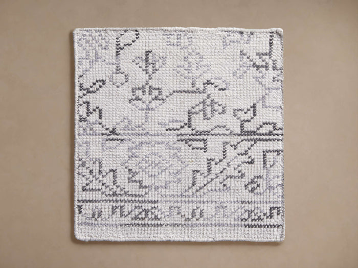 Flora Performance Rug Swatch, white with abstract light and dark grey patterns, rectangular, laid flat.