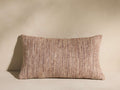 Fraisor Pillow: Rectangular, textured beige and brown woven pillow with subtle tonal variations, resting on a light surface.