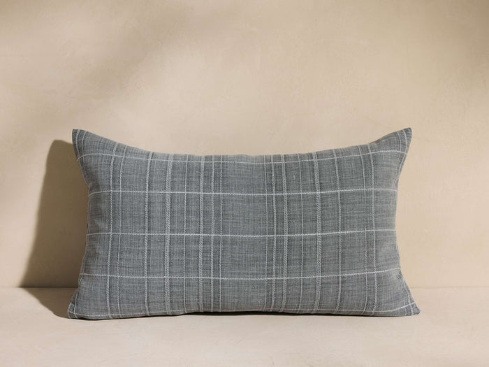 Francis Pillow, a gray rectangular pillow with a subtle white plaid pattern, resting horizontally against a light neutral background.