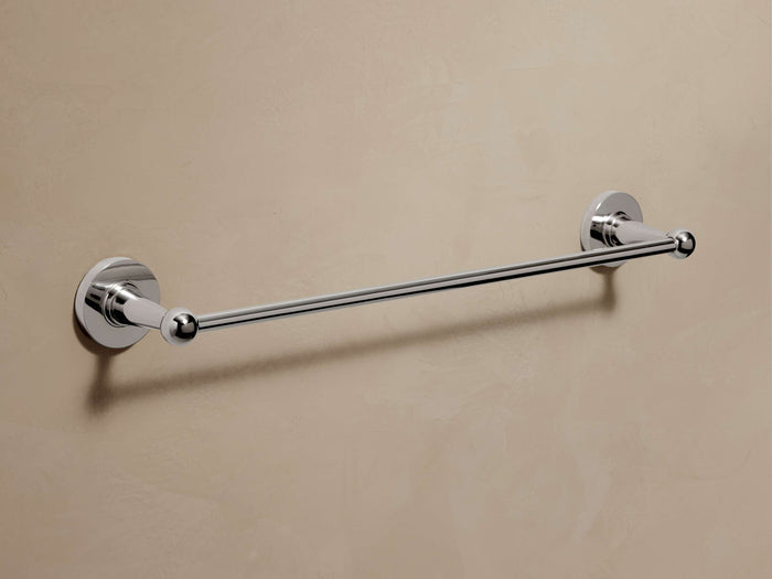 Polished nickel Fulton Towel Bar mounted horizontally on a beige wall, featuring decorative round ends.