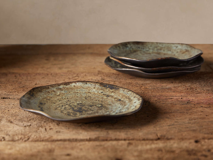 Gallatin Salad Plates, set of 4. Reactive glazed green, brown, neutral stoneware with organic edges on rustic wood.